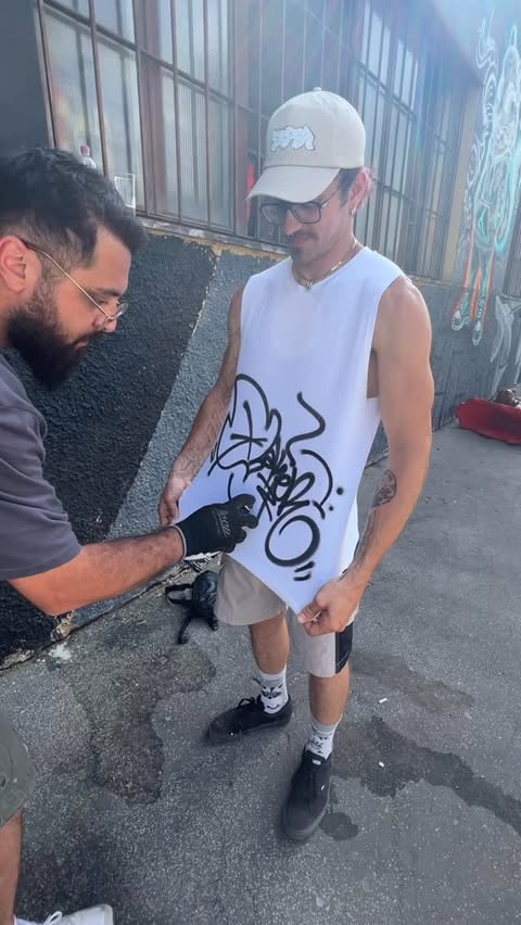 Tagging a t-shirt in graffiti festivals is a... Cover